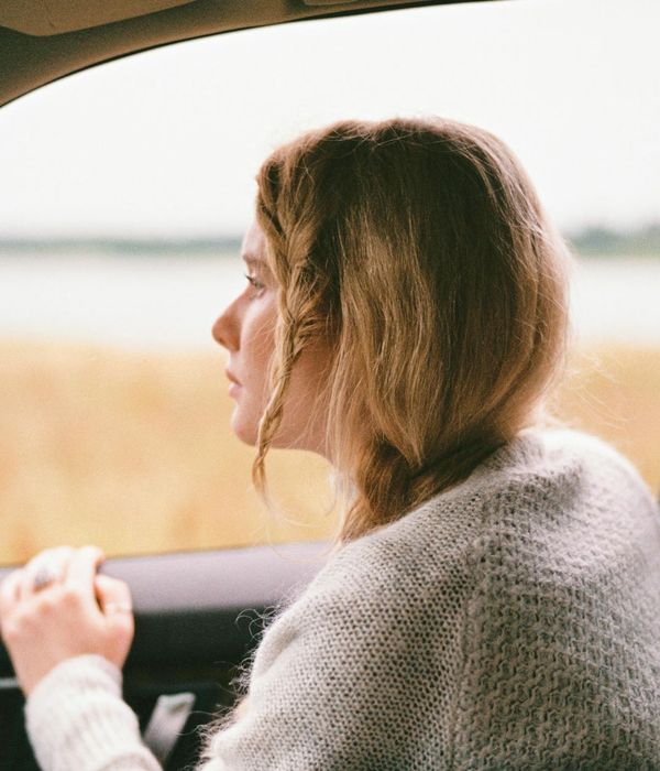 Woman with a calm and focused expression, looking forward.